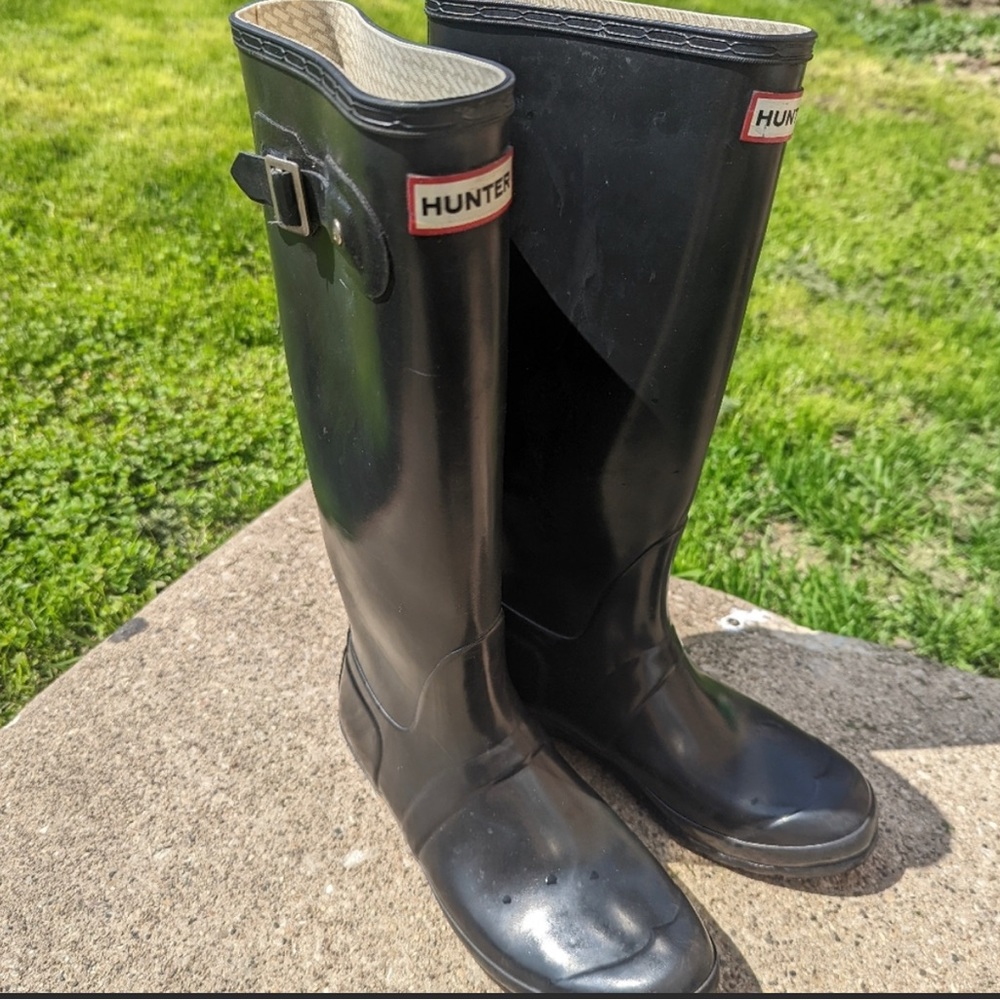 Glossy black tall Hunter boots